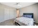 Bedroom featuring double closets, carpet, and neutral paint at 10650 Dryades Ave, Las Vegas, NV 89166