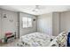 Inviting bedroom with carpet, a large window with neighborhood view, and natural light at 10650 Dryades Ave, Las Vegas, NV 89166