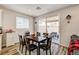 Dining area adjacent to a sliding door, offering natural light and easy patio access at 10650 Dryades Ave, Las Vegas, NV 89166