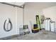 Garage featuring an electric vehicle charging station and water softener system at 10650 Dryades Ave, Las Vegas, NV 89166