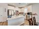 Bright kitchen featuring stainless steel appliances, white cabinets, and a large island at 10650 Dryades Ave, Las Vegas, NV 89166