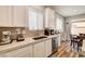 Bright kitchen featuring white cabinets, stainless steel appliances, and modern countertops at 10650 Dryades Ave, Las Vegas, NV 89166