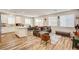 Open-concept living space with wood floors and a seamless flow to the dining and kitchen areas at 10650 Dryades Ave, Las Vegas, NV 89166