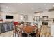 Open-concept living space featuring a dining area, kitchen, and comfortable living room at 10650 Dryades Ave, Las Vegas, NV 89166