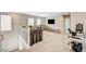Spacious loft area with carpeting, natural light, and versatile space for entertainment or relaxation at 10650 Dryades Ave, Las Vegas, NV 89166