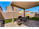 Outdoor patio with a lounge area and chairs, perfect for entertaining at 10650 Dryades Ave, Las Vegas, NV 89166