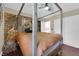 This beautiful bedroom features a unique accent wall, four poster bed and nice decor at 1105 Winwood St, Las Vegas, NV 89108