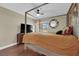 This lovely bedroom features a four poster bed, ceiling fan, and mounted TV at 1105 Winwood St, Las Vegas, NV 89108