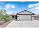 Charming single-story home with a well-maintained front yard and a two-car garage at 1105 Winwood St, Las Vegas, NV 89108