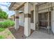 Inviting front porch with desert landscaping and secured entry gate at 1105 Winwood St, Las Vegas, NV 89108