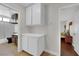 Hallway showing built in cabinet storage, plus access to a bathroom and bedroom at 1105 Winwood St, Las Vegas, NV 89108
