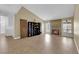 Spacious living room with tile floors, brick fireplace, and large windows offering natural light at 1105 Winwood St, Las Vegas, NV 89108