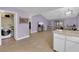 Bright and spacious living room with tile flooring, leading to a laundry area at 1105 Winwood St, Las Vegas, NV 89108