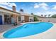 Backyard pool area with ample patio space, mature trees, and privacy fencing for relaxation and enjoyment at 1105 Winwood St, Las Vegas, NV 89108
