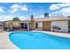 Backyard oasis featuring a sparkling pool, patio area, and lush greenery, perfect for entertaining at 1105 Winwood St, Las Vegas, NV 89108