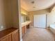 Bright bathroom featuring a soaking tub, dual sinks and tiled flooring at 1177 Twinkling Meadows Dr, Henderson, NV 89012