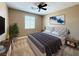Cozy bedroom featuring a queen sized bed, and a ceiling fan at 1177 Twinkling Meadows Dr, Henderson, NV 89012