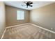 Bright bedroom featuring neutral walls and carpet at 1177 Twinkling Meadows Dr, Henderson, NV 89012