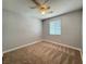 Bright bedroom with neutral walls and carpet and a ceiling fan at 1177 Twinkling Meadows Dr, Henderson, NV 89012