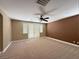 Large bedroom with a ceiling fan and double doors to the yard at 1177 Twinkling Meadows Dr, Henderson, NV 89012