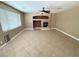 Spacious living room featuring a fireplace and a ceiling fan at 1177 Twinkling Meadows Dr, Henderson, NV 89012