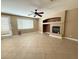 Spacious living room with a fireplace and tile flooring throughout at 1177 Twinkling Meadows Dr, Henderson, NV 89012