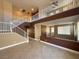 Open living room with high ceilings, large windows, and a staircase to the upper level at 1177 Twinkling Meadows Dr, Henderson, NV 89012
