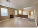 Open living room featuring a fireplace, large windows, and tile flooring at 1177 Twinkling Meadows Dr, Henderson, NV 89012