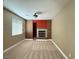 Cozy office space with a fireplace and ceiling fan at 1177 Twinkling Meadows Dr, Henderson, NV 89012