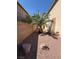 Narrow side yard with desert landscaping and brick privacy wall at 1177 Twinkling Meadows Dr, Henderson, NV 89012