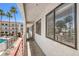 Exterior balcony showcasing bright day, nearby pool, and the condo's exterior at 1381 E University Ave # 204, Las Vegas, NV 89119