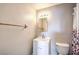 This bathroom has a white vanity and is brightly lit with a mirrored wall at 1381 E University Ave # 204, Las Vegas, NV 89119