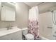 A simple, clean bathroom with a shower-tub combo and a white vanity at 1381 E University Ave # 204, Las Vegas, NV 89119