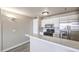 The kitchen has stainless steel appliances and white cabinets and bar seating at 1381 E University Ave # 204, Las Vegas, NV 89119