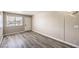 The living area has a front door with modern laminate floors and natural light at 1381 E University Ave # 204, Las Vegas, NV 89119