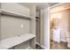A walk-in closet with shelves and storage options connected to a bathroom at 1381 E University Ave # 204, Las Vegas, NV 89119