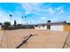 Expansive backyard with modern, white home and clear blue sky, offering outdoor living and landscaping potential at 1648 J St, Las Vegas, NV 89106