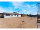 Large backyard under a clear blue sky, providing ample space for outdoor activities and potential customization at 1648 J St, Las Vegas, NV 89106