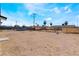 Spacious backyard showcasing potential for landscaping and outdoor recreation under a beautiful blue sky at 1648 J St, Las Vegas, NV 89106