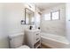Updated bathroom featuring a modern vanity, tub and shower combination at 1648 J St, Las Vegas, NV 89106