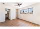 Comfortable bedroom with wood flooring, a ceiling fan, and closet at 1648 J St, Las Vegas, NV 89106