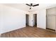 Spacious bedroom featuring wood flooring, a ceiling fan, and closet at 1648 J St, Las Vegas, NV 89106