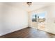 Cozy dining area with wood-look flooring, modern light fixture, and sliding glass door at 1648 J St, Las Vegas, NV 89106