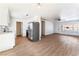 Bright, open kitchen featuring stainless steel appliances and wood-look floors at 1648 J St, Las Vegas, NV 89106