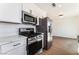 Modern kitchen featuring stainless steel appliances and ample countertop space at 1648 J St, Las Vegas, NV 89106