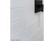 A close-up showcases the sleek, tiled shower with modern fixtures at 1648 J St, Las Vegas, NV 89106
