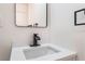 This bathroom vanity features a modern faucet and a sleek mirror at 1648 J St, Las Vegas, NV 89106