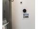 Close-up of a wall with plumbing hookups, showing necessary connections for appliances or fixtures at 1648 J St, Las Vegas, NV 89106