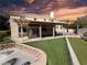 Beautiful backyard with covered patio, artificial grass, bocce ball court, and built in fire pit at 2140 Desert Peak Rd, Las Vegas, NV 89134