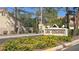 Las Colinas entrance sign with beautiful flowers in a well-manicured community at 2140 Desert Peak Rd, Las Vegas, NV 89134